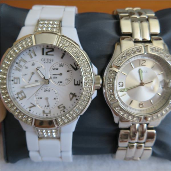 GUESS woman's watches.  Both are lightly used and in working condition.  No COA - see photos.