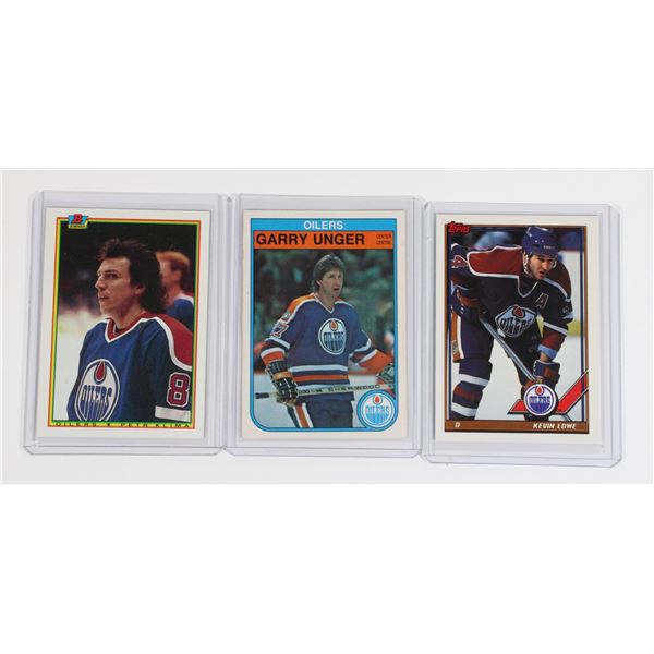 3 HOCKEY CARDS IN SLEEVES OILERS, KEVIN LOWE..