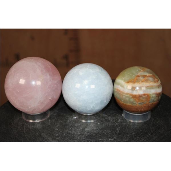3 Mineral Spheres. (1) ROSE QUARTZ, (1) BLUE CELESTITE, and (1) GREEN BANDED ONYX