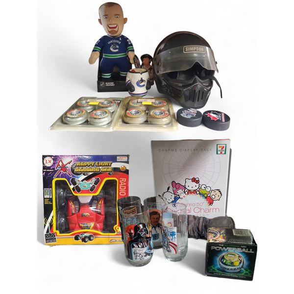 Lot of Assorted Collectibles and Moto Helmet: Cups, Charms, Canucks Doll, Pucks