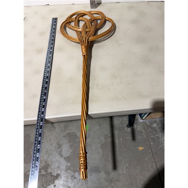 traditional rattan carpet beater.