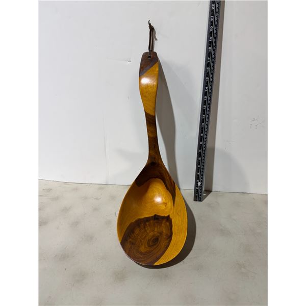 hand-carved wooden ladle or serving spoon, likely made from teak or jobillo wood.