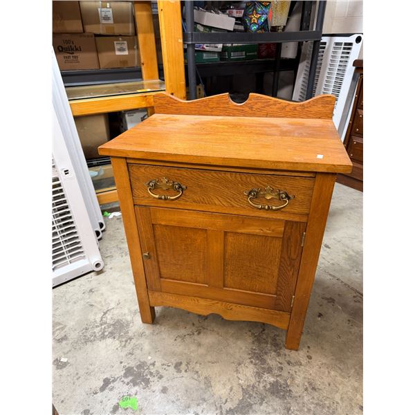 Antique cabinet measures 24" x 15 and three-quarter inches and 30 inches tall