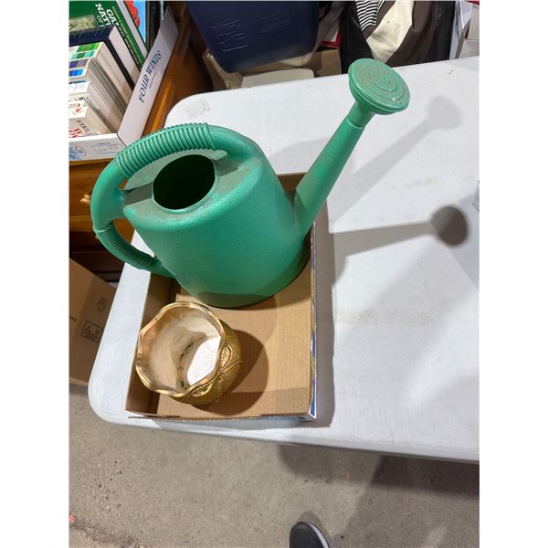 Watering can  and  planter
