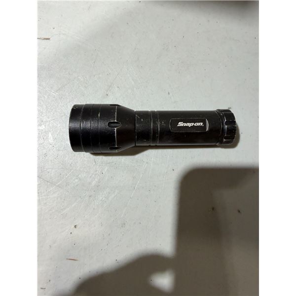 Snap-on flashlight needs batteries