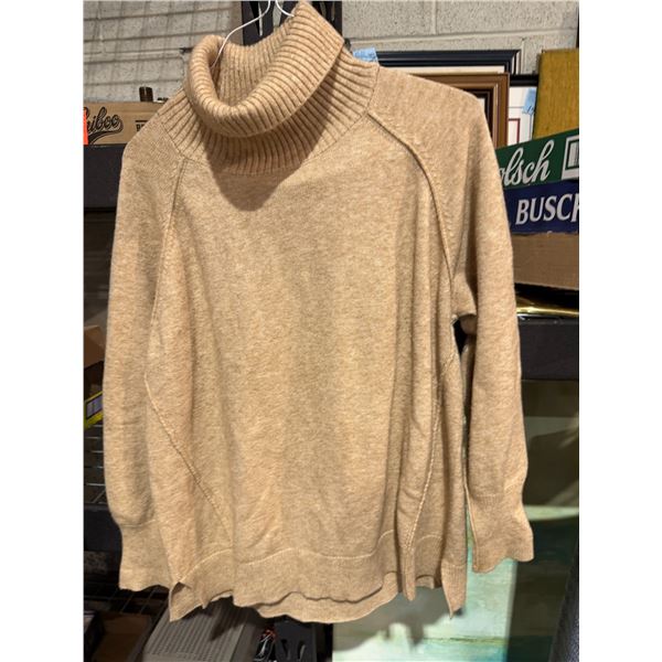 Sweater size not shown
