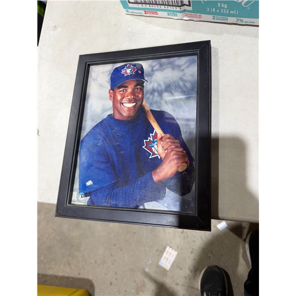 framed photograph is of former Toronto Blue Jays player Carlos Delgado