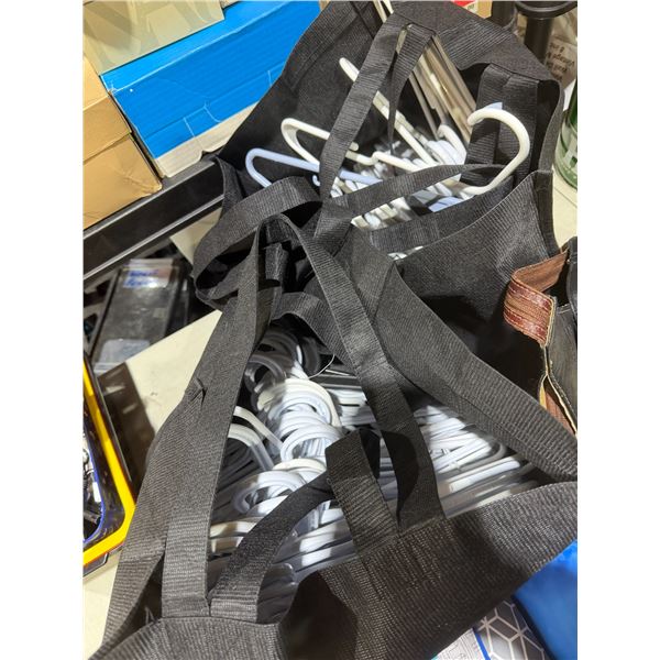 2 bags of plastic hangers