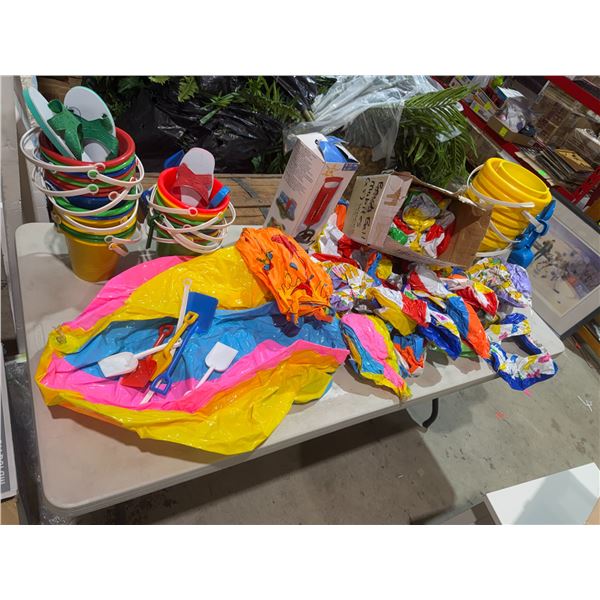 Beach, buckets, and beach balls and pump