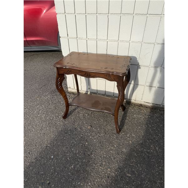 Accent table measures 22" x 12 1/2" x 23" tall