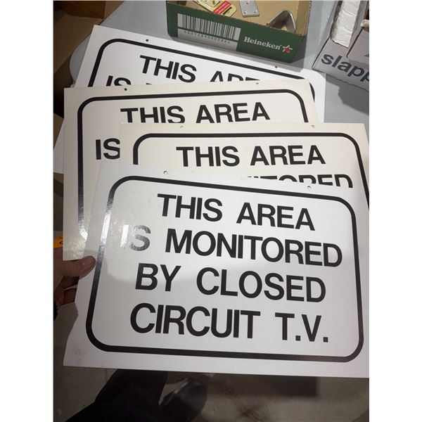 This area is monitored signs