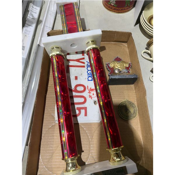 Trophy and Medal and Alberta license plate
