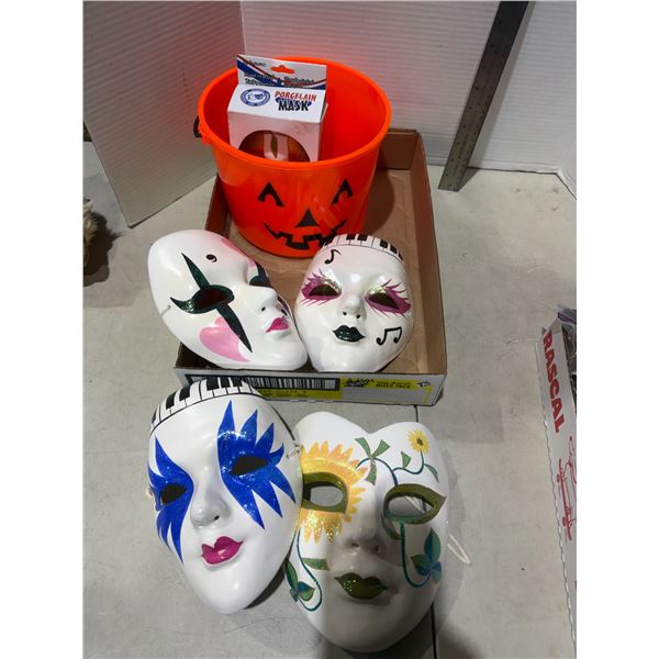 Masks and pumpkin bucket
