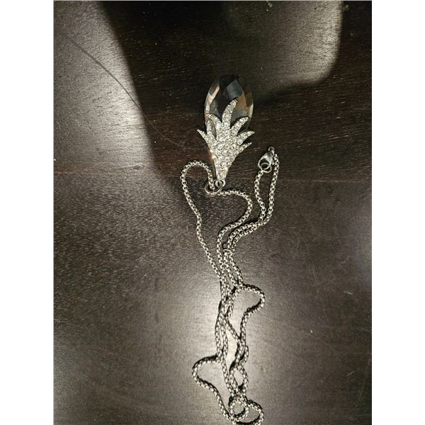 long dangly necklace with crystal pendant