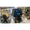 Image 1 : MILERMATIC 211 AUTOSET WITH MVP WIRE FEED WELDER ON WHEELED CART WITH GAUGES, HELMET. TANK