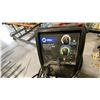 Image 2 : MILERMATIC 211 AUTOSET WITH MVP WIRE FEED WELDER ON WHEELED CART WITH GAUGES, HELMET. TANK
