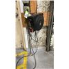 Image 1 : DEWENILS WALL MOUNTED EXTENSION CORD REEL LOCATED IN ZONE 4D- BRING TOOLS TO REMOVE FROM WALL