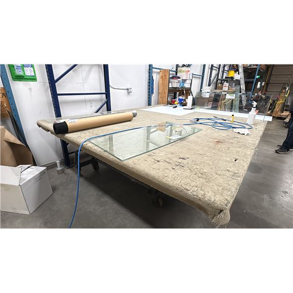 TILTING WORK TABLE. 10' X 8' CARPET COVERED. TILTS TO 90 DEGREES. ON WHEELS