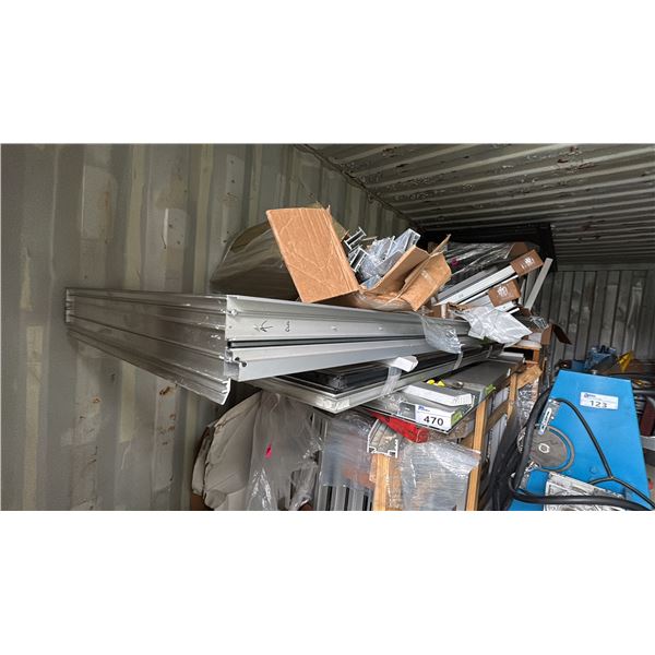 GROUP OF ALUMINUM WINDOW FRAMES IN CONTAINER AND A COUPLE OF WAREHOUSE LIGHTS