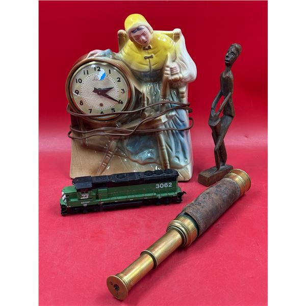 Vintage Variety: Model Train, Monoscope, African Statue, & Porcelain Clock