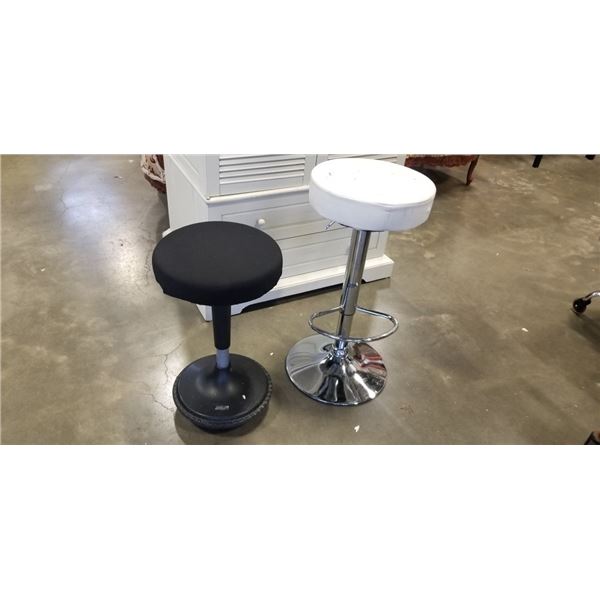 WHITE GAS LIFT STOOL AND BLACK UNCAGED ERGONOMICS STOOL