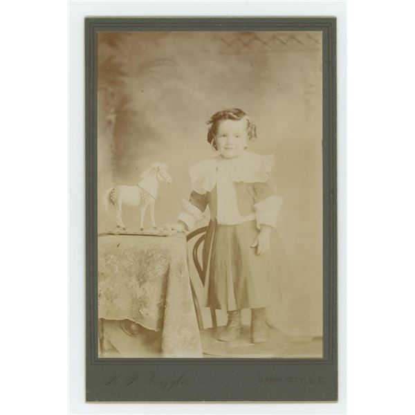 South Dakota Child with Pull Toy Cabinet Photo