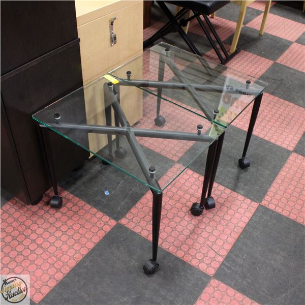 TWO GLASS AND METAL END TABLE WITH WHEELS,