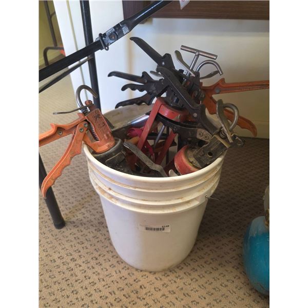 Seven Assorted Glue, Caulking, and Grease Guns