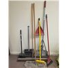 Image 1 : Cleaning Tools Including Mops, Brooms, and Dustpans