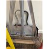 Image 2 : Cleaning Tools Including Mops, Brooms, and Dustpans