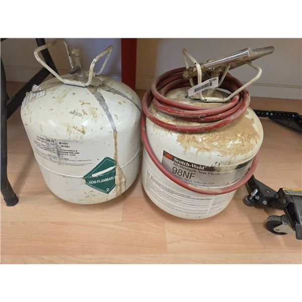 Two Propane Tanks with Attached Hoses and Spray Nozzle