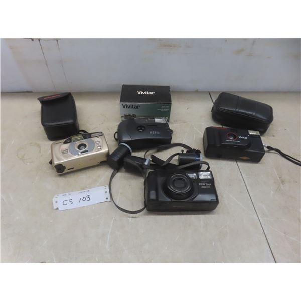 Four Cameras Including Vivitar, Champion, Pentax, and Bell & Howell