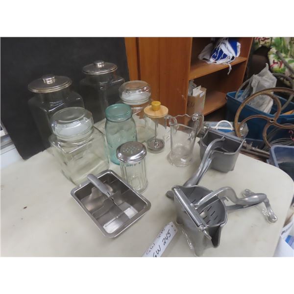 Glass Canister And Kitchenware Lot With Sugar Shaker, Sealer Jar, Creamer And Hand Pressed Juicer