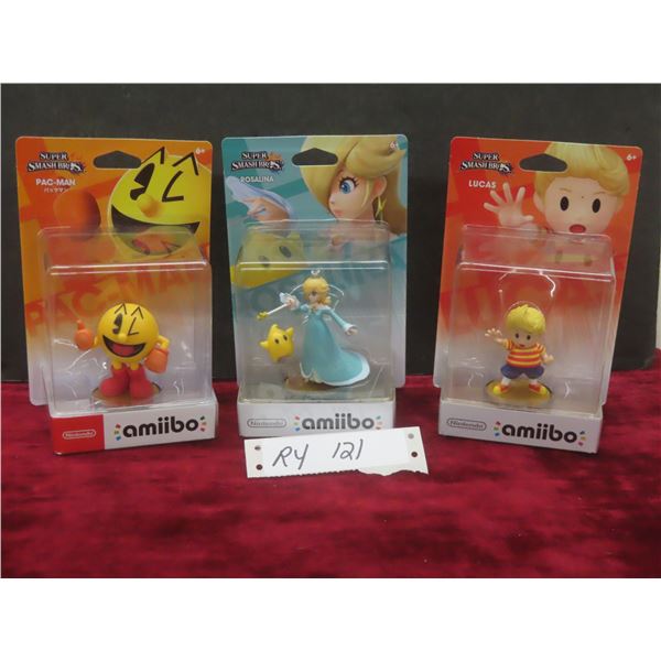 Three Amiibo Figures: Pac-Man, Rosalina, and Lucas