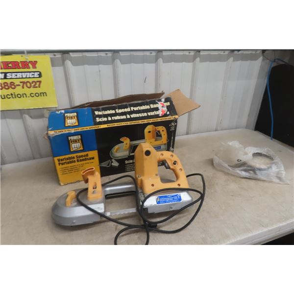Variable-Speed Portable Band Saw With 4 New Spare Blades.