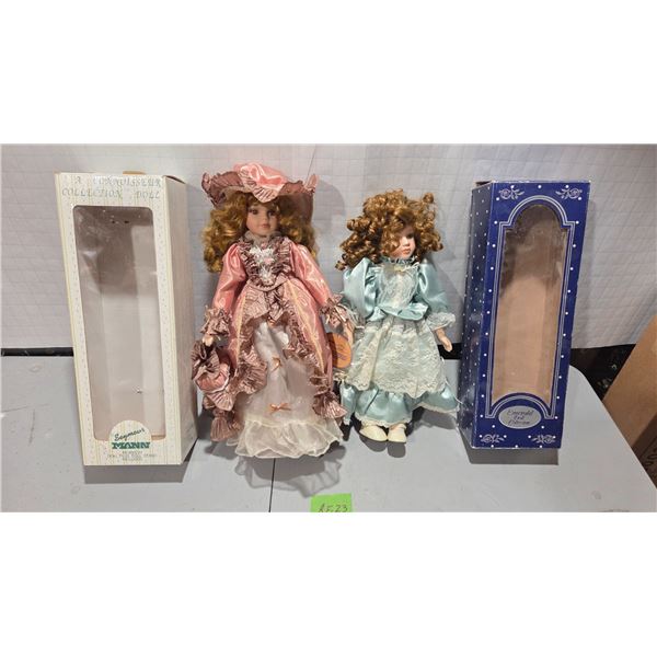 One Seymour Mann 16" Collector’s Porcelain Doll with Stand and One 16" Emerald Porcelain Doll.