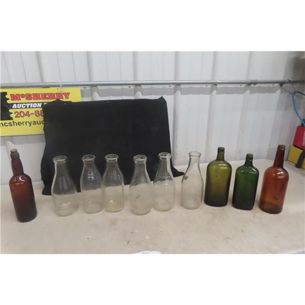 6 Milk Bottles With Labels And 4 Old Booze Bottles