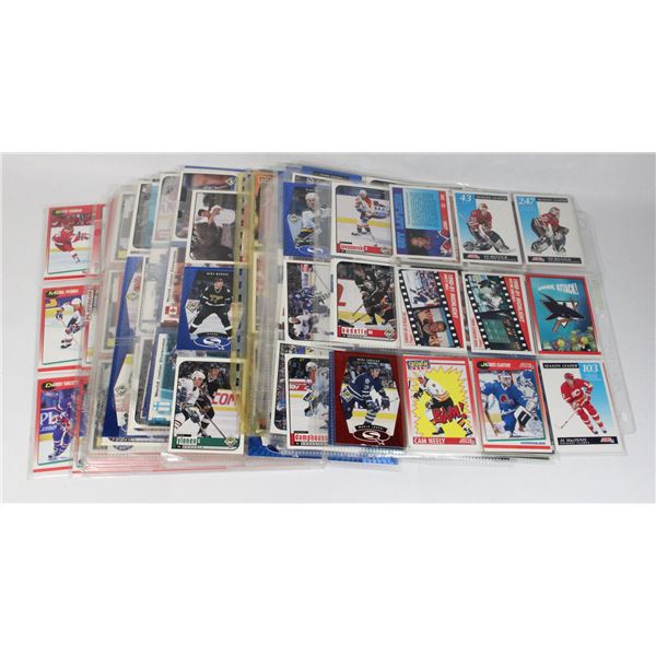 PILE OF HOCKEY CARDS IN PAGE SLEEVES