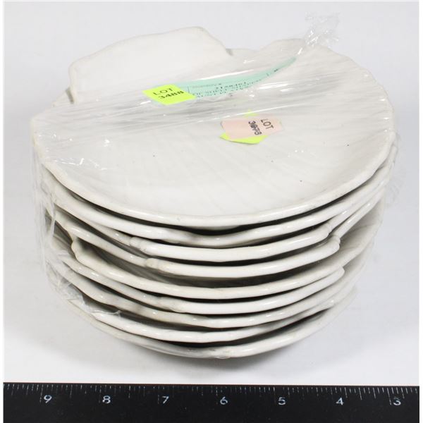 STACK OF SHELL SHAPED RESTAURANT PLATES