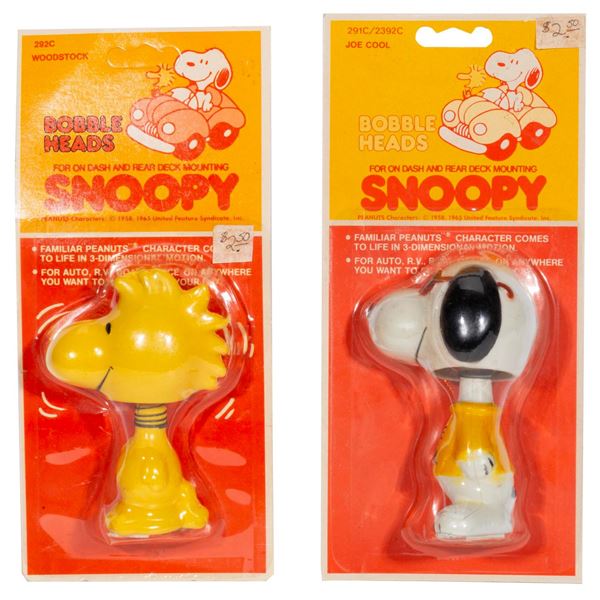 A Pair of Peanuts Dashboard Bobbleheads.