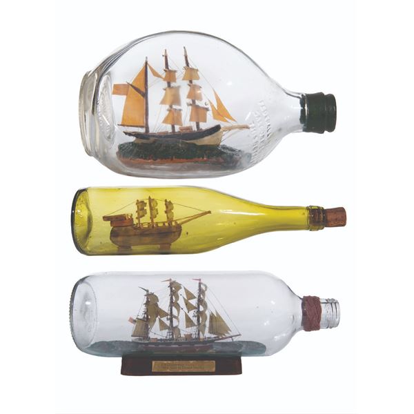 A Collection of Three Ships in Bottles.