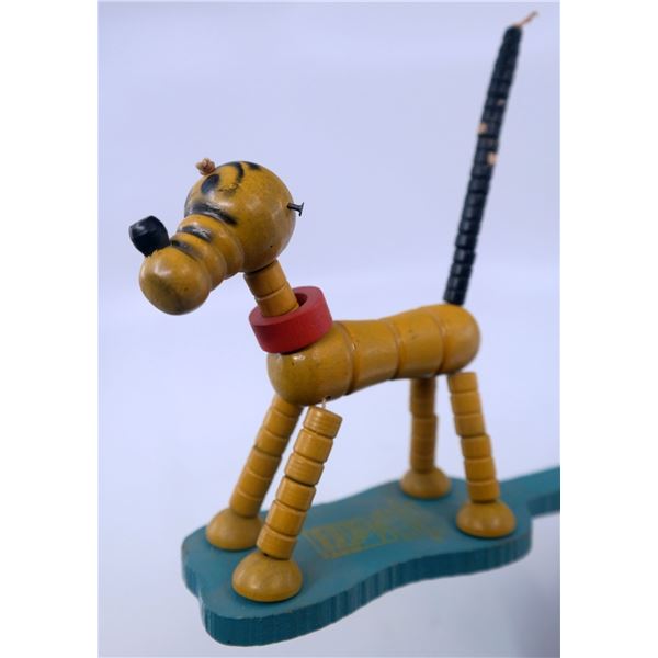 A Fisher Price Pop Up Kritter Pluto Toy.