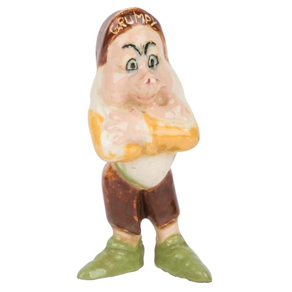 A Grumpy Ceramic Figure.