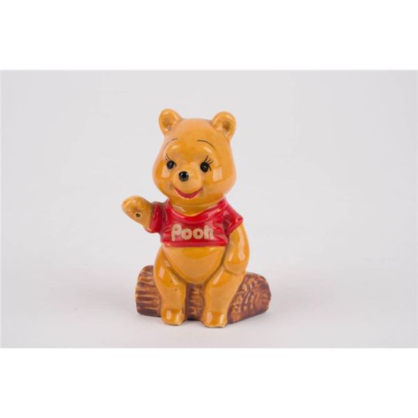 A Winnie the Pooh Ceramic Figurine by Enesco.