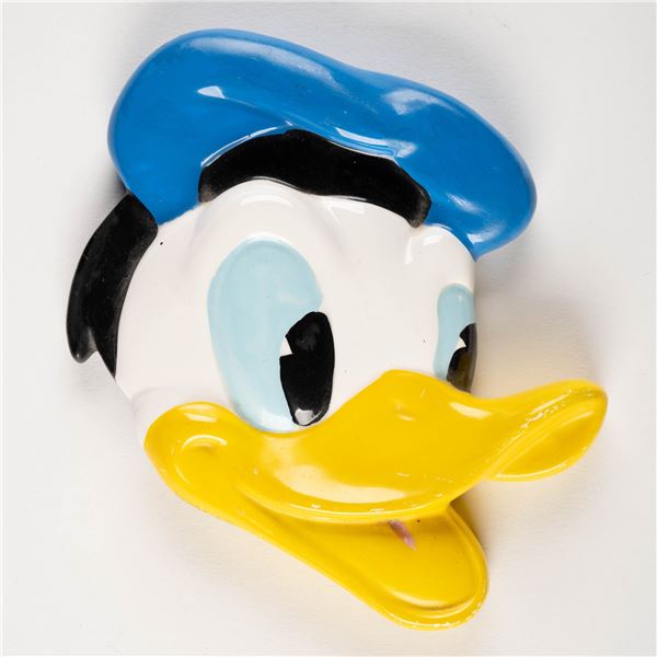 A Donald Duck Ceramic Paperweight.