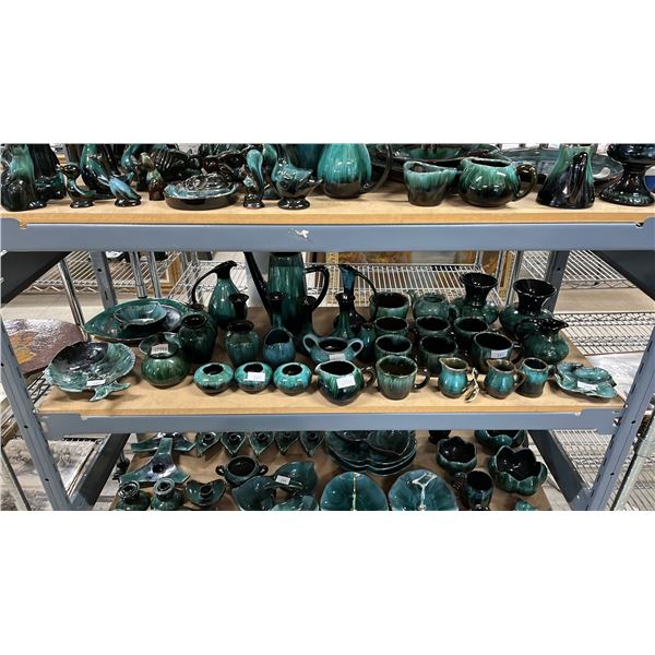 SHELF OF ASSORTED BLUE MOUNTAIN POTTERY COFFEE CUPS, VASES, TEAPOT, JUGS & MORE