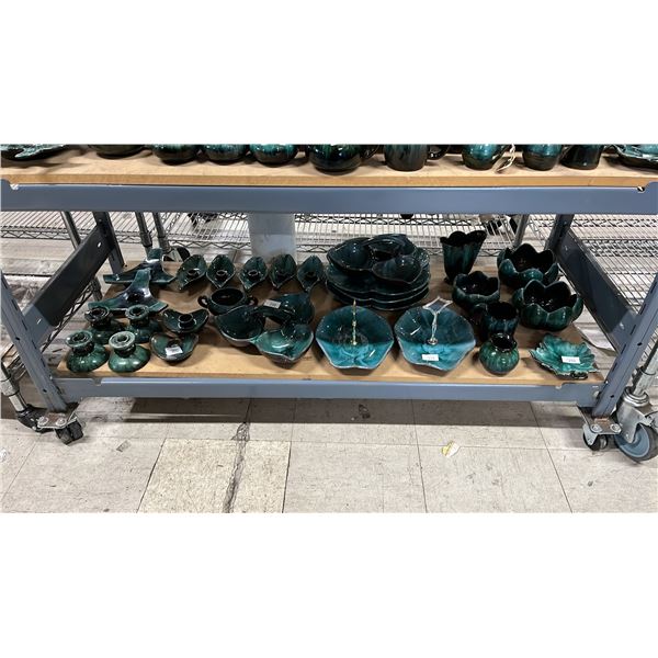 SHELF OF ASSORTED BLUE MOUNTAIN POTTERY DESSERT TRAYS, SERVING TRAYS, CANDLE STICKS & MORE