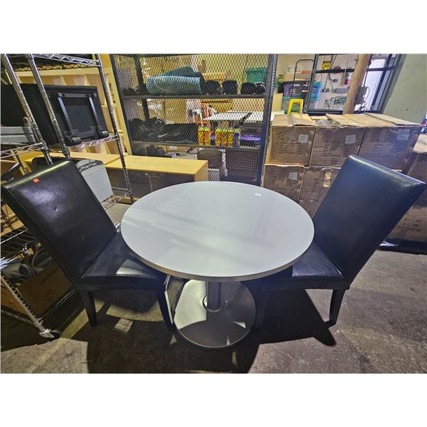 ROUND GREY 35.5" DIAMETER TABLE WITH METAL BASE & (2) BLACK FAUX LEATHER UPHOLSTERED CHAIRS