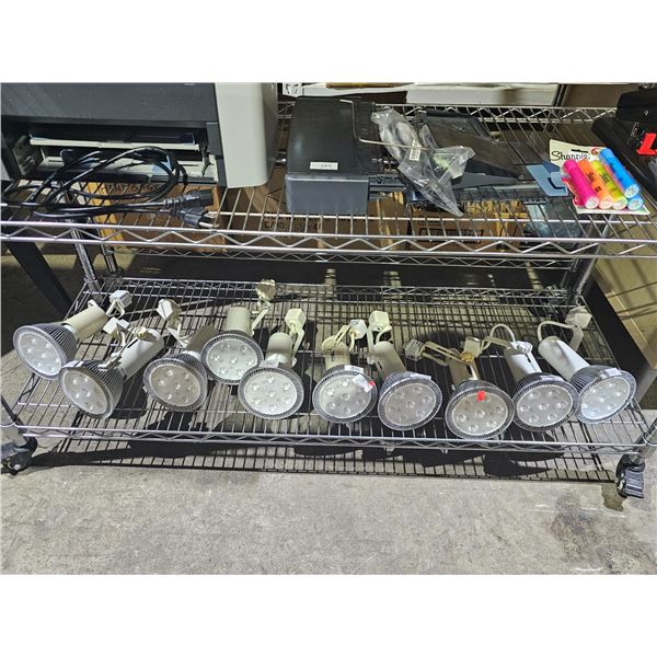SHELF OF ASSORTED LITELINE ADJUSTABLE SPOTLIGHTS FOR MOUNTING ON A LIGHTING TRACK