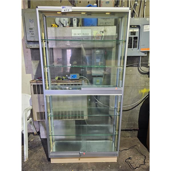 GLASS & METAL DISPLAY CABINET WITH SLIDING DOORS: APPROX. 72"T X 36"W X 10"D *HAS LOCK & KEY*